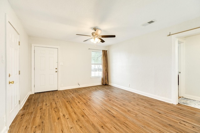 unfurnished room with ceiling fan and light hardwood / wood-style floors