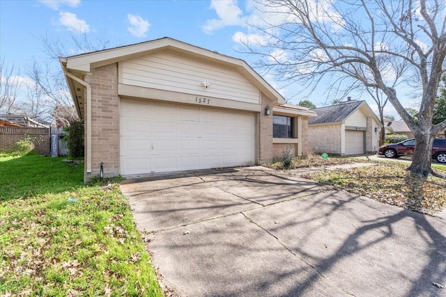 ranch-style home featuring a garage