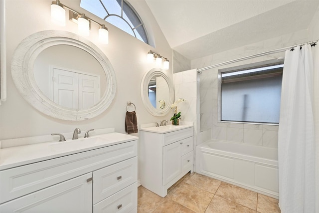 bathroom with shower / bath combination with curtain, lofted ceiling, tile patterned flooring, and vanity