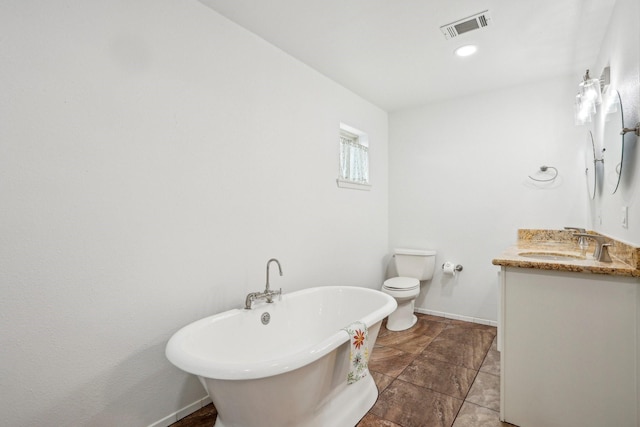 bathroom featuring vanity, toilet, and a bathing tub