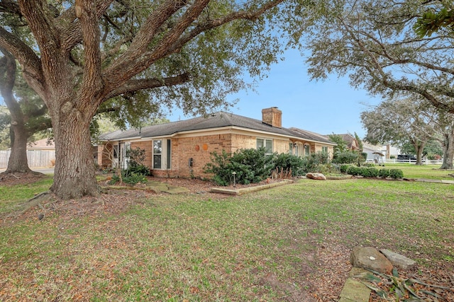 view of property exterior featuring a lawn