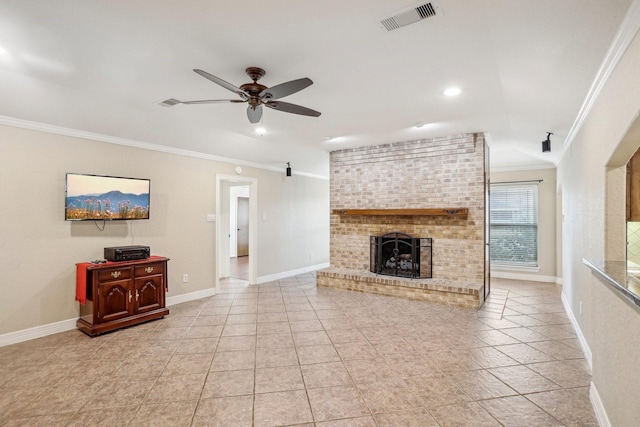 living room featuring crown molding, ceiling fan, a fireplace, and light tile patterned floors