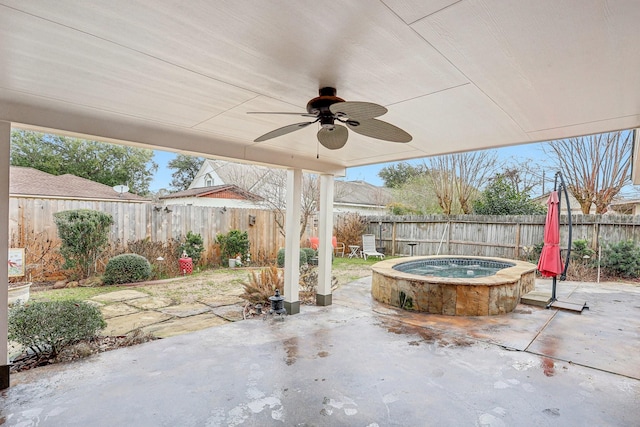 view of patio with a hot tub and ceiling fan