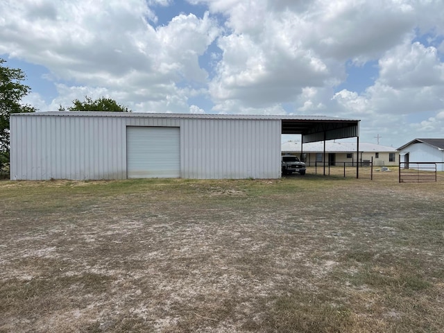 view of outdoor structure with a garage