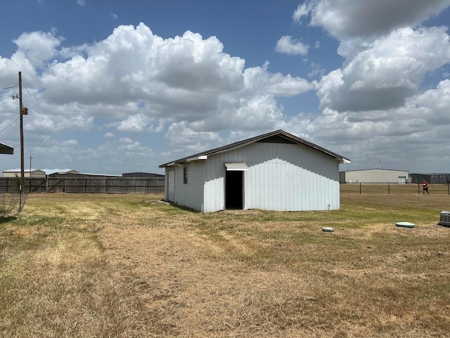 view of outdoor structure with a yard