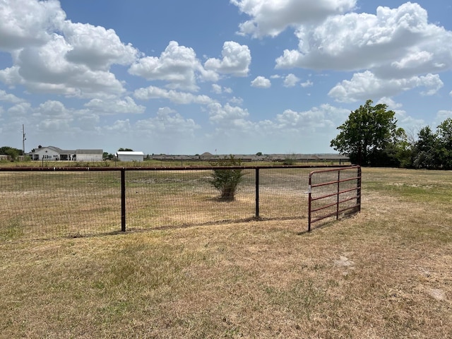 view of yard with a rural view