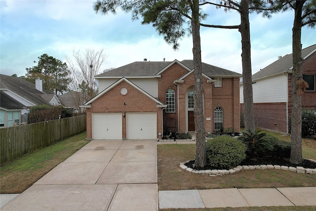 view of front property with a garage and a front lawn