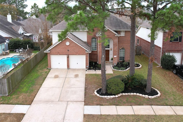 front of property with a garage and a front yard