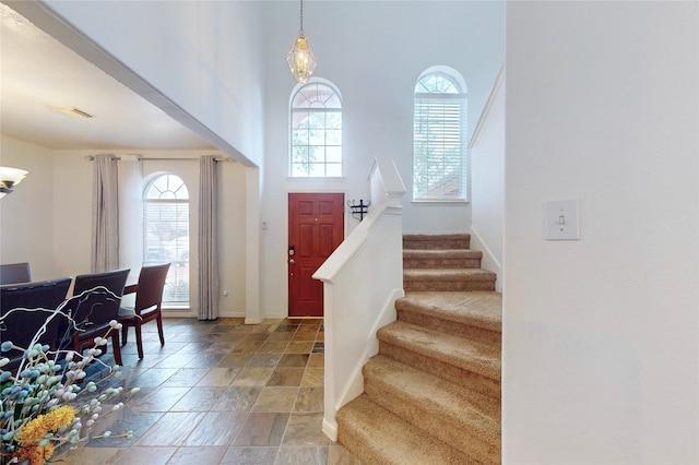 entryway with a towering ceiling