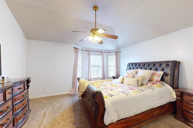 bedroom featuring light carpet and ceiling fan