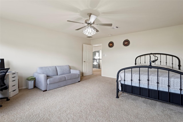 bedroom featuring ceiling fan and light carpet