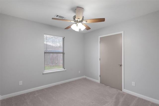 carpeted empty room with ceiling fan