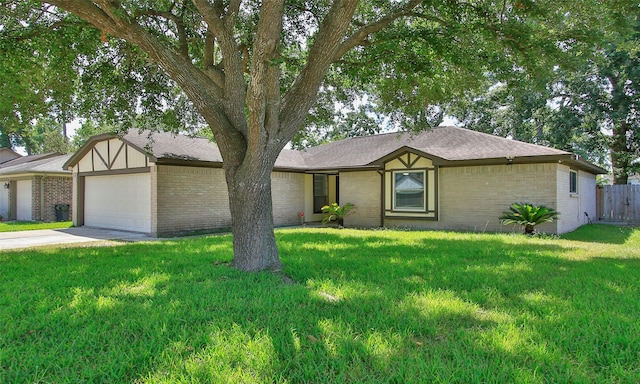 ranch-style house with a garage and a front lawn