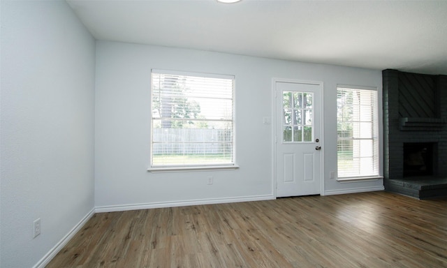 interior space featuring hardwood / wood-style floors and a fireplace