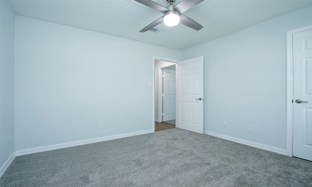 unfurnished bedroom featuring ceiling fan and carpet flooring