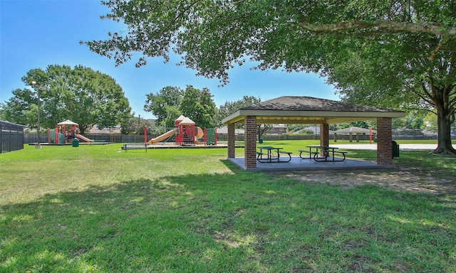 view of community with a yard, a gazebo, and a playground