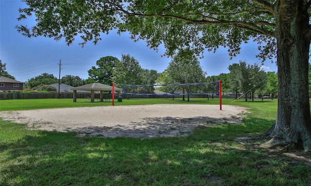 view of community featuring a gazebo, volleyball court, and a lawn