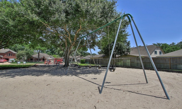 view of property's community with a playground