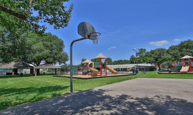 view of jungle gym featuring a gazebo, basketball hoop, and a lawn