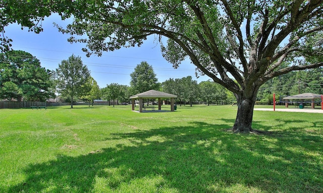 surrounding community featuring a gazebo and a lawn