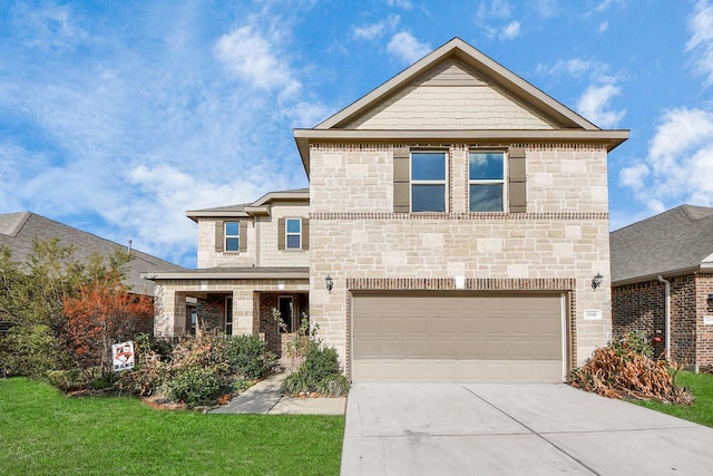 view of front of house featuring a garage and a front lawn