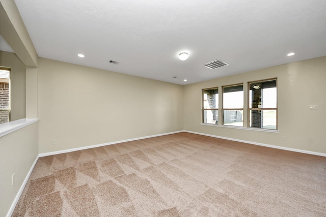 empty room featuring light colored carpet