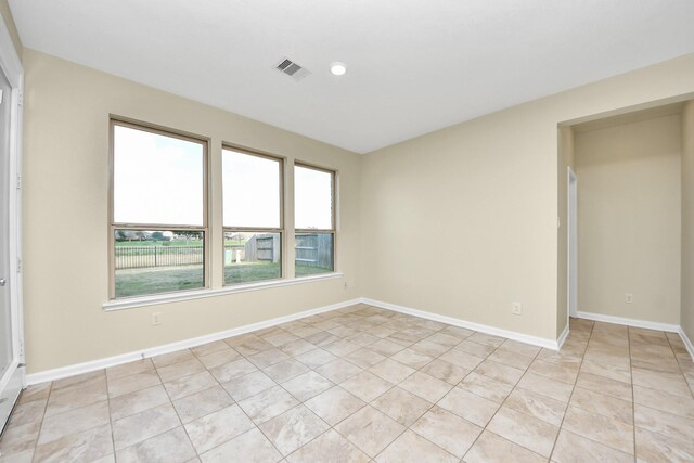 empty room with light tile patterned floors