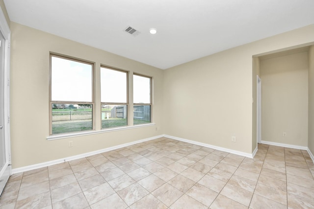 empty room featuring light tile patterned floors