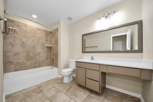 full bathroom with vanity, tile patterned floors, toilet, and tiled shower / bath