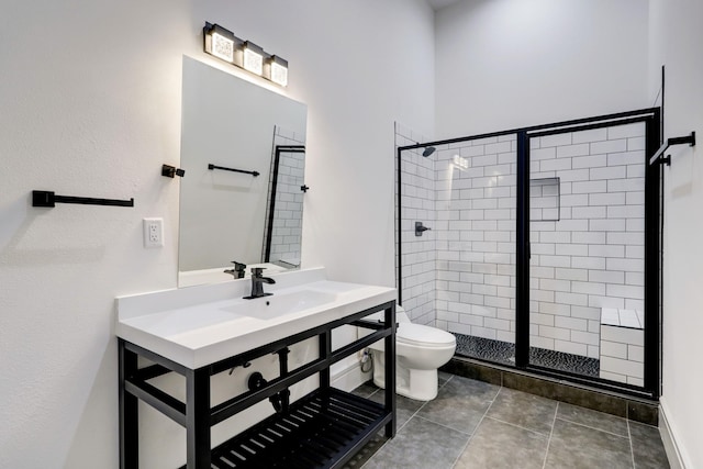 bathroom with tile patterned flooring, sink, a shower with door, and toilet