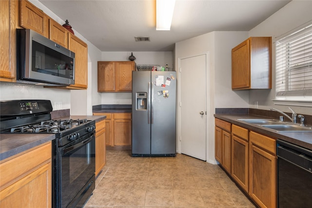 kitchen with sink and black appliances