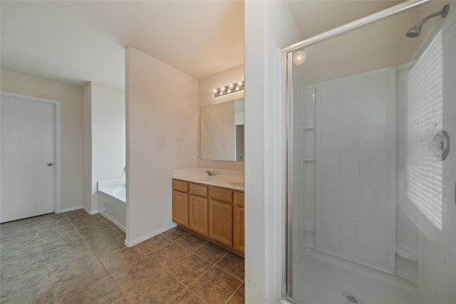 bathroom with vanity, tile patterned flooring, and separate shower and tub