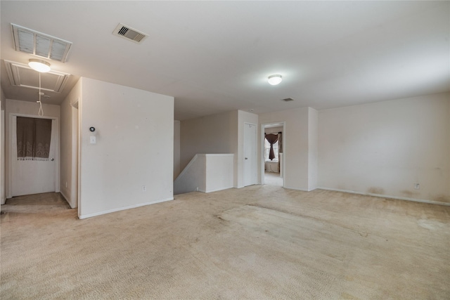 unfurnished room with light carpet