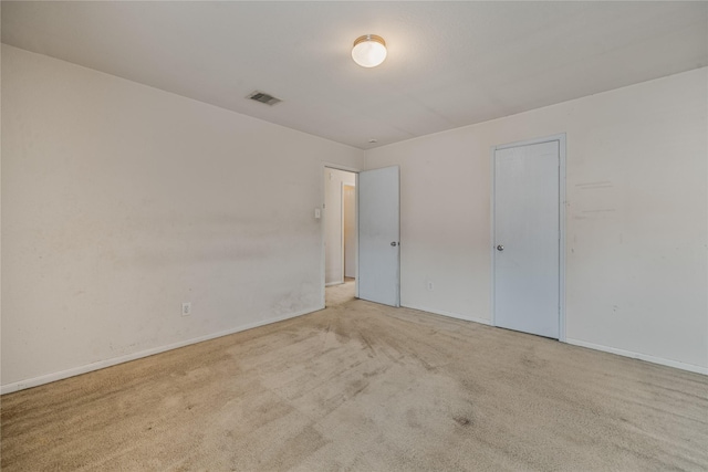 unfurnished bedroom featuring light colored carpet