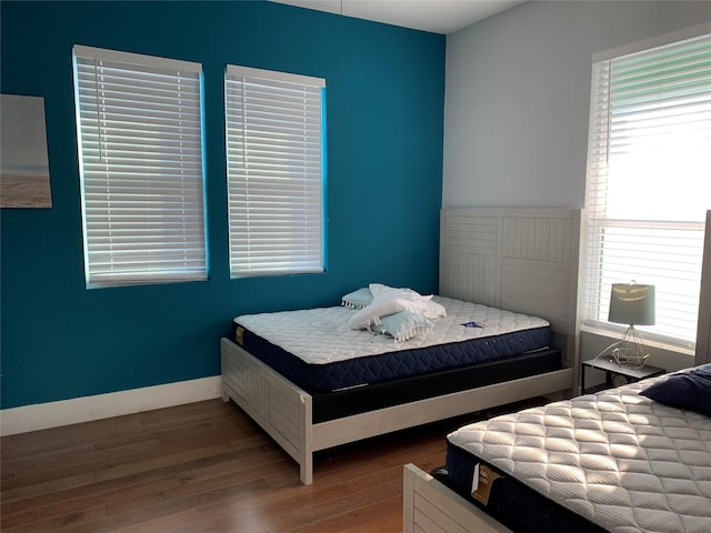 bedroom with hardwood / wood-style flooring