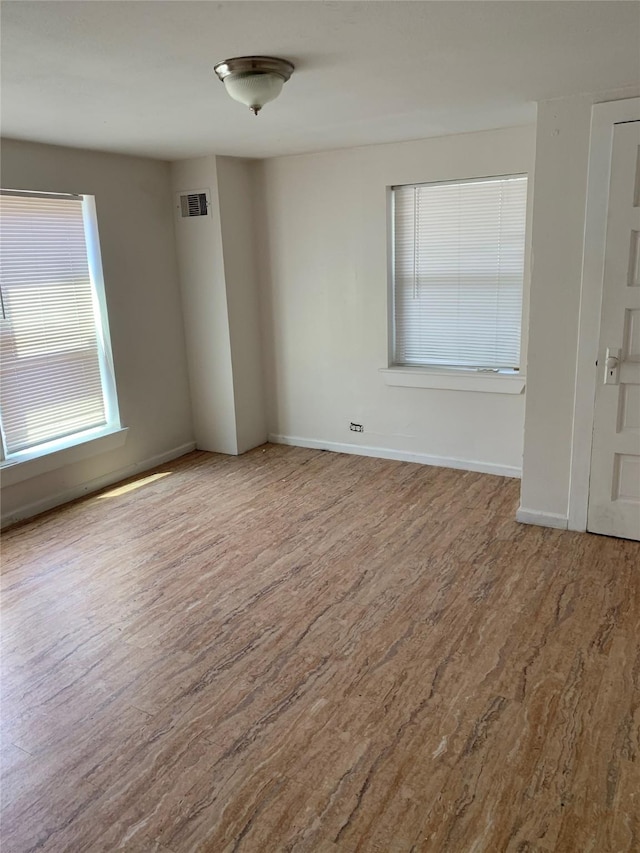 empty room featuring hardwood / wood-style floors