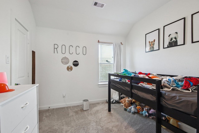 carpeted bedroom with vaulted ceiling