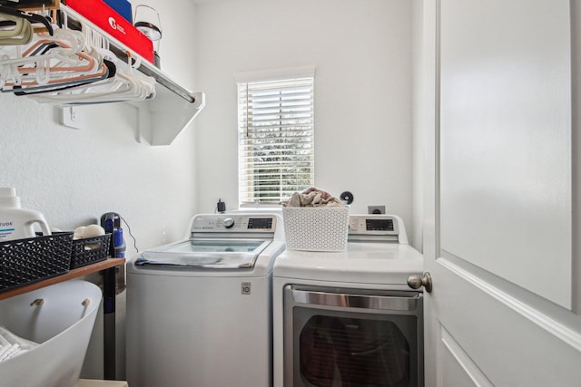 laundry area with independent washer and dryer