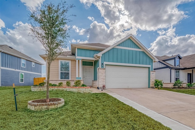 view of front of property featuring a garage and a front yard