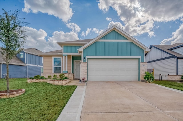 view of front of home with a garage and a front lawn