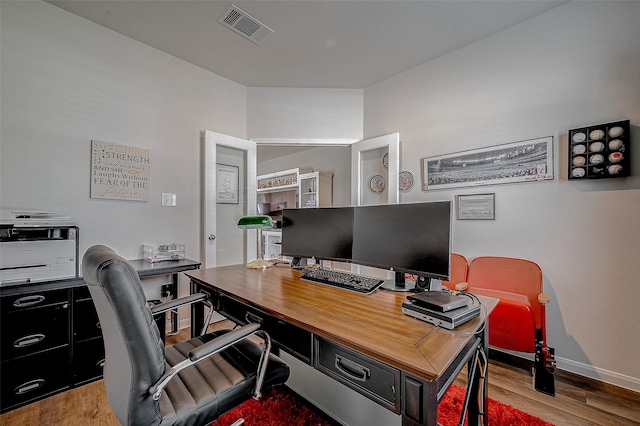 office space with light wood-type flooring