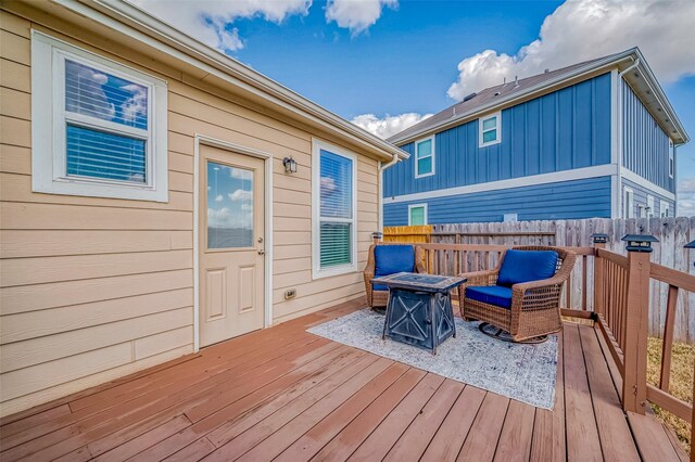 deck with an outdoor fire pit