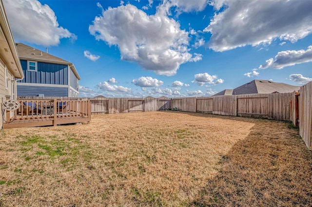 view of yard featuring a wooden deck