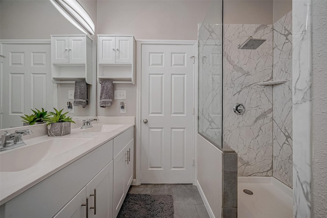 bathroom featuring vanity and tiled shower