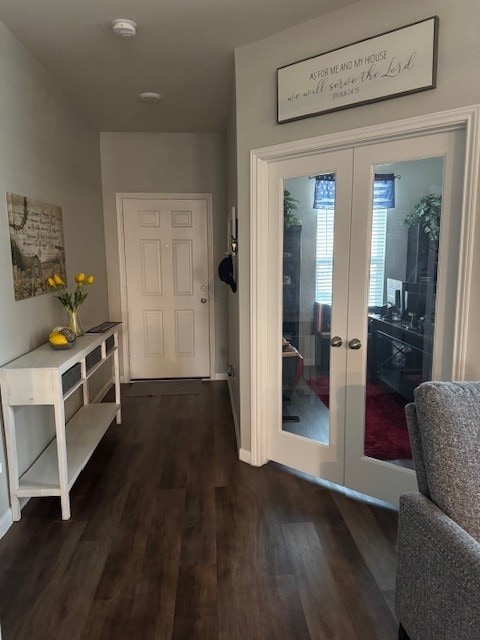 doorway to outside with dark hardwood / wood-style flooring and french doors