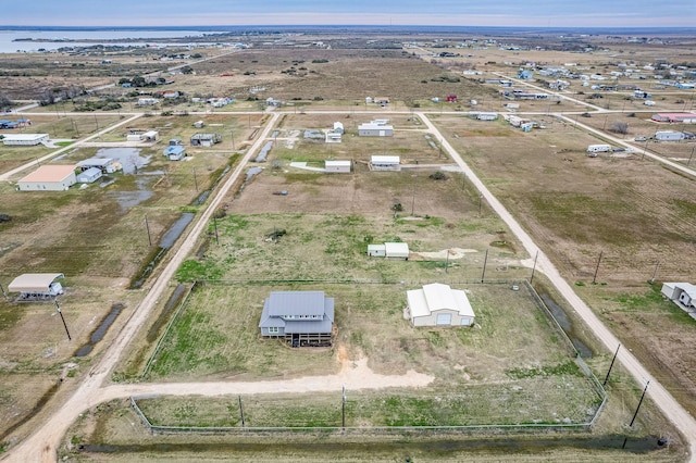 birds eye view of property featuring a rural view