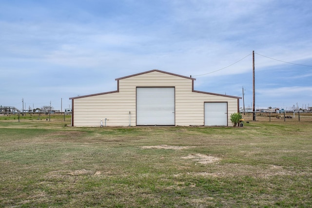 garage featuring a lawn