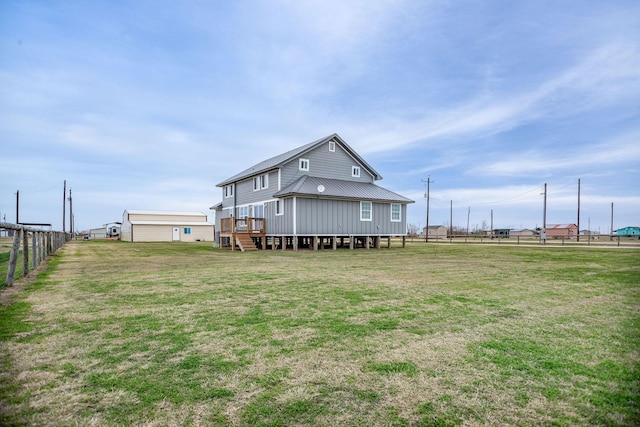 rear view of house with a yard