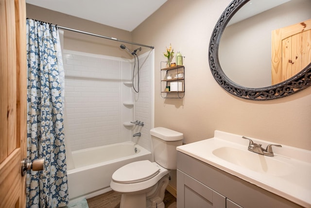 full bathroom featuring hardwood / wood-style flooring, shower / tub combo with curtain, vanity, and toilet