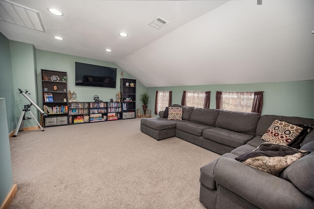 carpeted living room with lofted ceiling